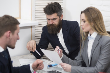 Lady manager tries to organize working process with colleagues in office. Business colleagues at meeting, office background. Office atmosphere concept. Business negotiations, discuss working tasks