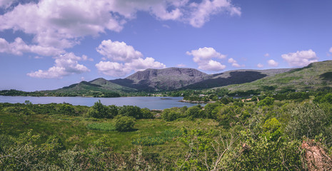 Fototapeta na wymiar The scenic fields and sea as seen from road leading to Healy pass, from the village of Adrigole, situated on the Beara Peninsula in County Cork.