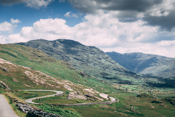 The scenic road of Healy Pass, a 12 km route worth of hairpin turns winding through the borderlands of County Cork and County Kerry in Ireland