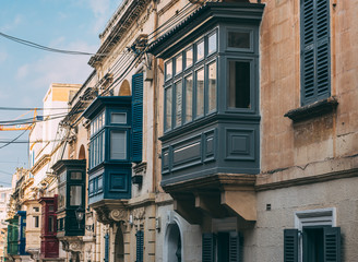 Fototapeta na wymiar Street view in Sliema with traditional balconies, Malta