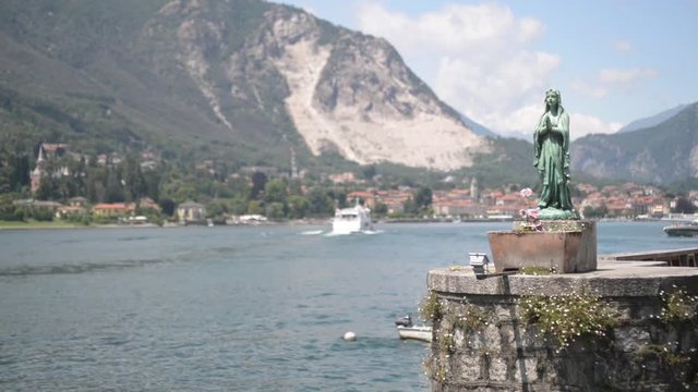 Lake Navigation ships and boats on Lago Maggiore Italy. Boats moored on the waterfront, rocking on the waves