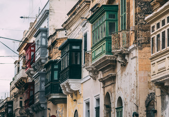 Fototapeta na wymiar Street view in Birgu with traditional balconies, Malta