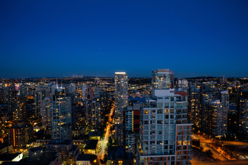 Aerial view of the Downtown City Buildings during the night after sunset. Taken in Vancouver, British Columbia, Canada.