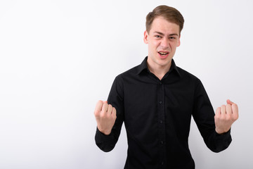 Young handsome businessman against white background