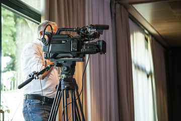mature man camera operator