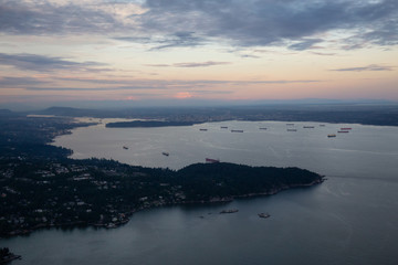 Obraz premium Aerial view of the Horseshoe Bay during a vibrant sunset. Taken in Vancouver, British Columbia, Canada.