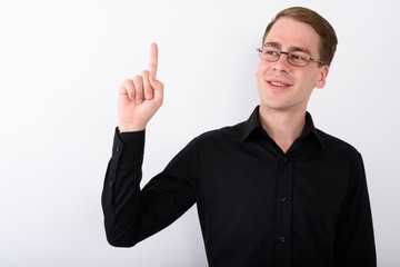 Young handsome businessman against white background