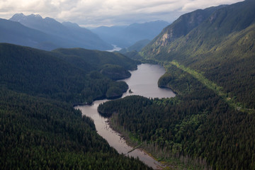 Aerial view of Buntzen Lake during a cloudy evening. Taken in Vancouver, British Columbia, Canada.