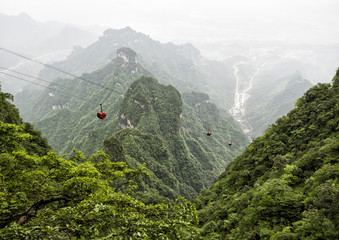 The longest cableway in the world, landscape view with mountains, green forest and mist - Tianmen Mountain, The Heaven's Gate at Zhangjiagie, Hunan Province, China, Asia