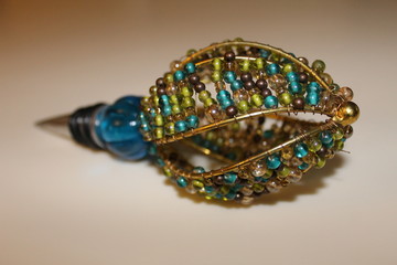 Close up of a decorative bottle topper.