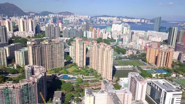 Drone fly over the Hong Kong urban city in Kowloon side district
