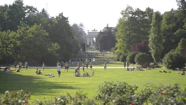 People relaxing in the city of Milan Sempione Park