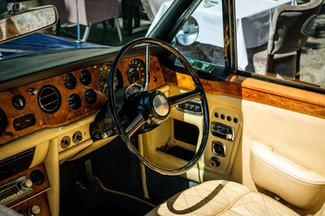 Steering wheel, dashboard and interior of  vintage car cockpit / oldtimer  
