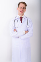 Young handsome man doctor against white background