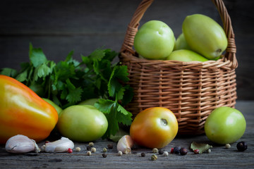 Green tomatoes in a basket.