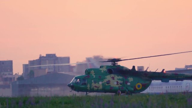 Military helicopter stands on the airfield before take off