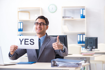 Fototapeta na wymiar Businessman in positive yes answer in the office