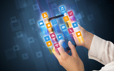 Female hand using smartphone with colorful angular fast switching application icons around