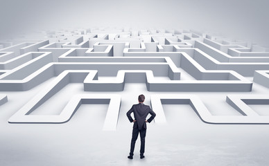 Businessman getting ready to enter a 3D flat labyrinth concept
