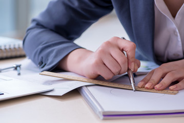 Businesswoman working at her desk in office