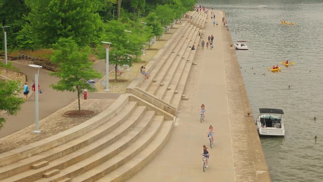 PITTSBURGH, PA - Circa June, 2018 - A daytime high angle view of people enjoying the shoreline along Point State Park in downtown Pittsburgh, Pennsylvania.  	