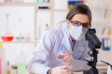 Lab chemist checking beauty and make-up products