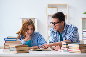 Pair of students studying for university exams