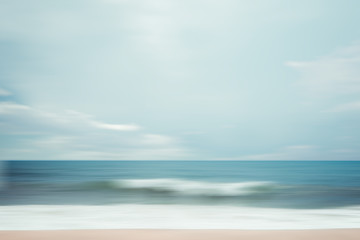 A seascape abstract beach background. panning motion blur with a long exposure, pastel colors in a...