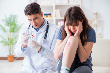 Fototapeta premium Patient visiting doctor after sustaining sports injury