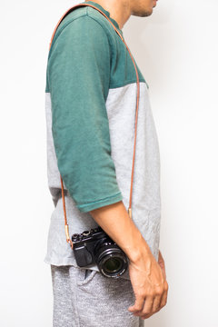 Hipster men with leather camera strap on white background
