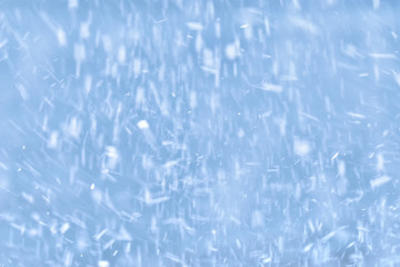 falling snow on a blue background