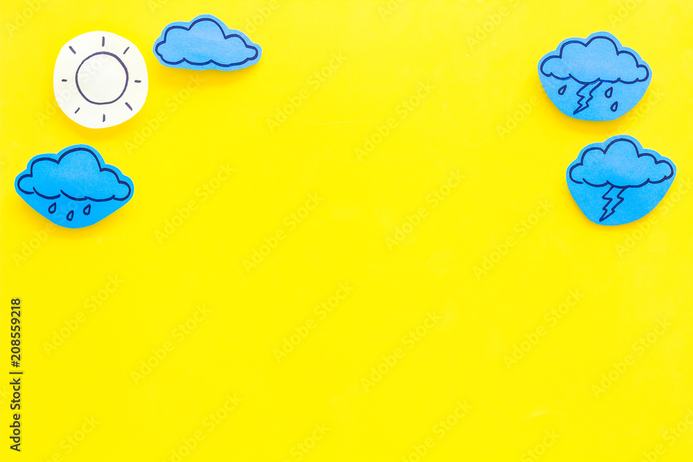 Wall mural modern weather icons set on yellow background top view copy space