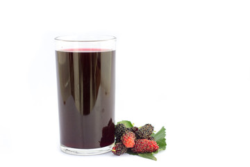 Mulberry juice in glass with ripe mulberry fruits on white isolated