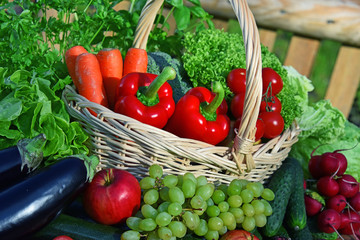 Variety of fresh organic vegetables in wicker basket