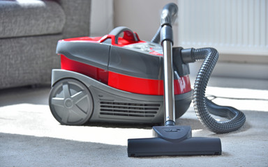 Canister vacuum cleaner for home use on the floor