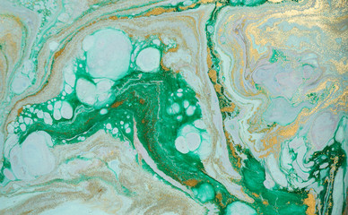 Marble abstract acrylic background. Marbling artwork texture. Agate ripple pattern. Gold powder.