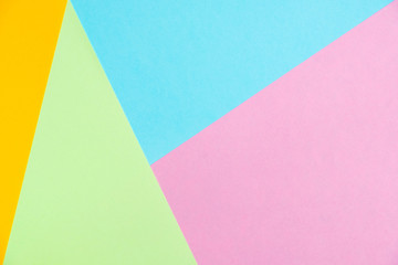 Pastel colored paper flat lay top view, background texture, pink, purple, yellow, beige, green and blue.