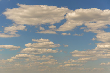 Blue sky with lots of white clouds. background.