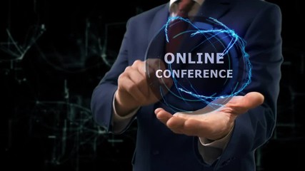 Businessman shows concept hologram Online conference on his hand. Man in business suit with future technology screen and modern cosmic background