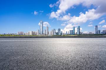 panoramic city skyline with empty asphalt road