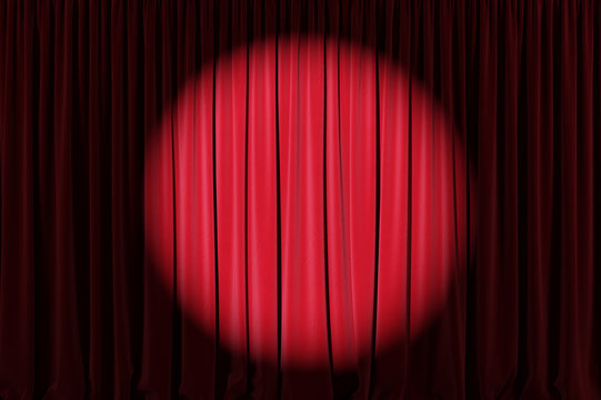 Background image of red velvet stage curtain with spotlight