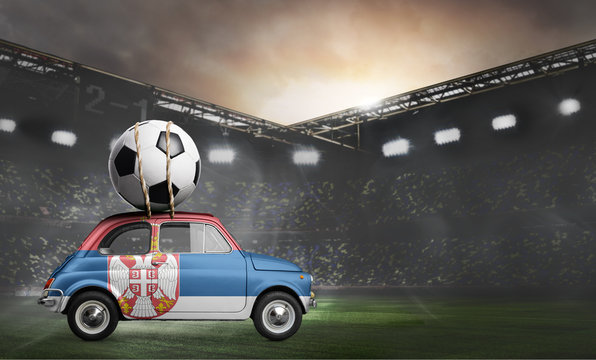 Serbia flag on car delivering soccer or football ball at stadium