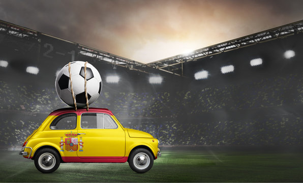 Spain flag on car delivering soccer or football ball at stadium