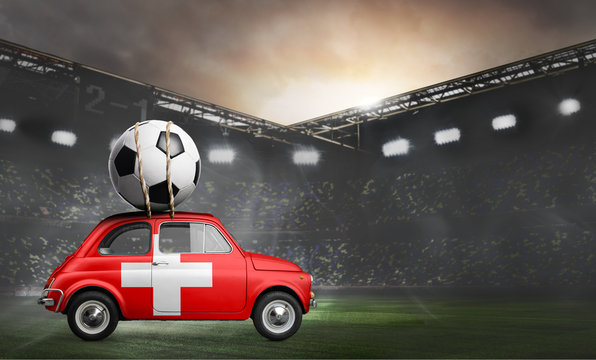 Switzerland flag on car delivering soccer or football ball at stadium