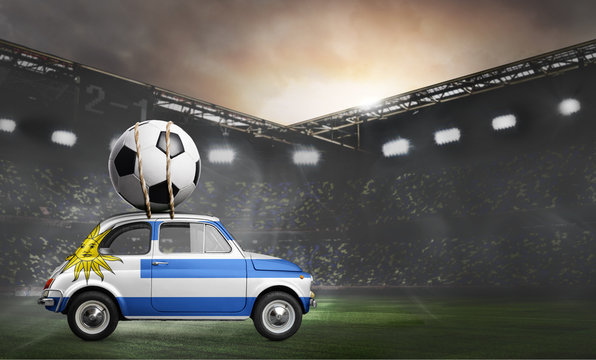 Uruguay flag on car delivering soccer or football ball at stadium