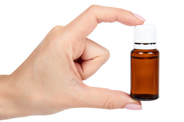 Brown glass medicine bottle with hand isolated on white background