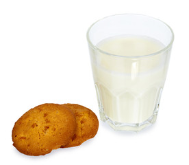 Glass of milk and homemade cookies isolated on white background