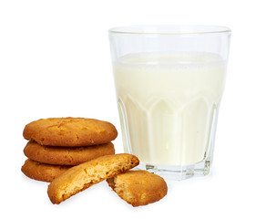 Glass of milk and homemade cookies isolated on white background