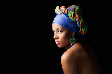 African black young woman beauty portrait with colorful turban headscarf studio shot