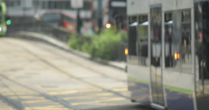 Blurred background of a tram on a high street